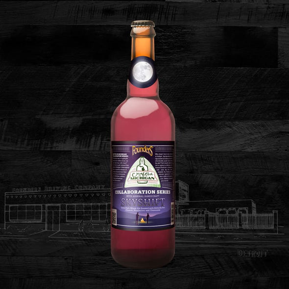 A bottle of Founders Skyshift beer, which has a violet hue, a violet label, and a moon on the bottle's neck.