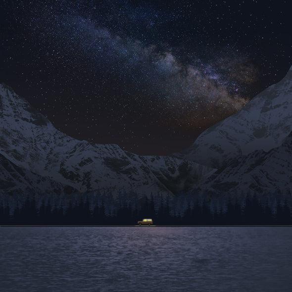 A vehicle driving at night with a scenic background that includes trees, mountains, and a starry sky.